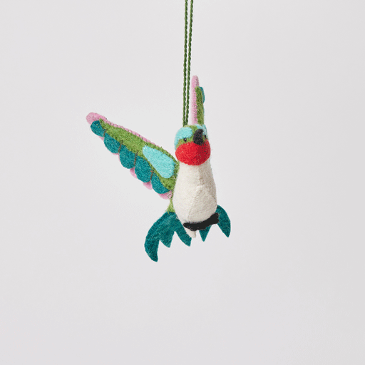 Craftspring’s Little Migrator Hummingbird Ornament from the Iconic Craftspring Ornaments Bundle rotating to show front, side, and back views — felt hummingbird with embroidered and beaded details, a whimsical ornament perfect for holiday gifting — heirloom-quality Christmas decor, ethically crafted by artisans using sustainable wool.