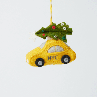 Craftspring’s Holiday Taxi Ornament from the Iconic Craftspring Ornaments Bundle rotating to show front, side, and back views — felt taxi with a Christmas tree on top, a whimsical ornament perfect for holiday gifting — heirloom-quality Christmas decor, ethically crafted by artisans using sustainable wool.