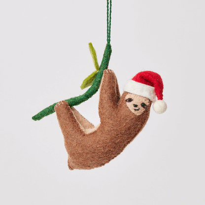 Craftspring’s Lazy Santa Sloth Ornament from the Iconic Craftspring Ornaments Bundle rotating to show front, side, and back views — felt sloth wearing a Santa hat with sweet holiday details, a playful ornament perfect for holiday gifting — heirloom-quality Christmas decor, ethically crafted by artisans using sustainable wool.