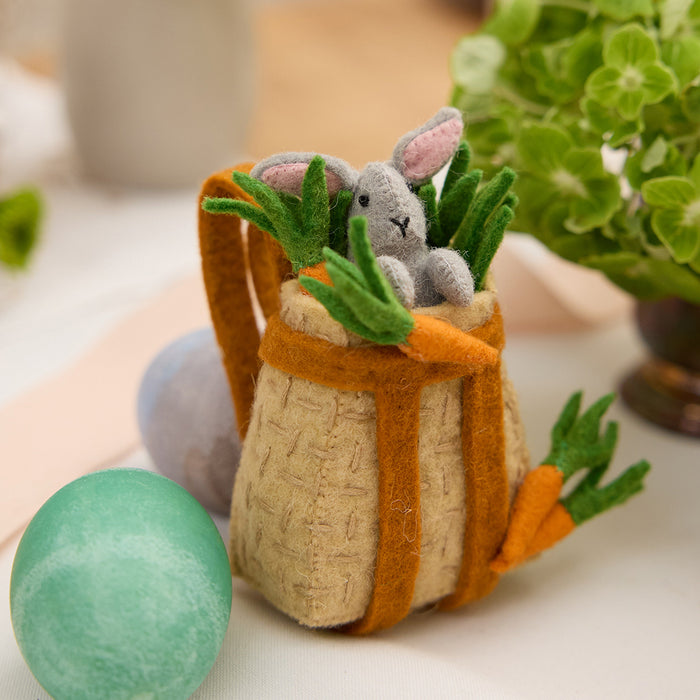 Spring felt bunny in traditional-style pack basket – whimsical ornament for seasonal shelves