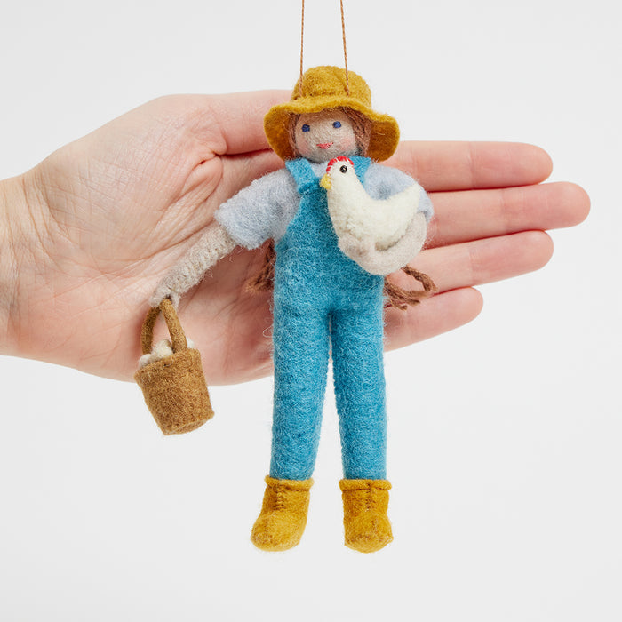 Handcrafted felt farmer with chicken and eggs – spring ornament symbolizing abundance, care, and homegrown joy.