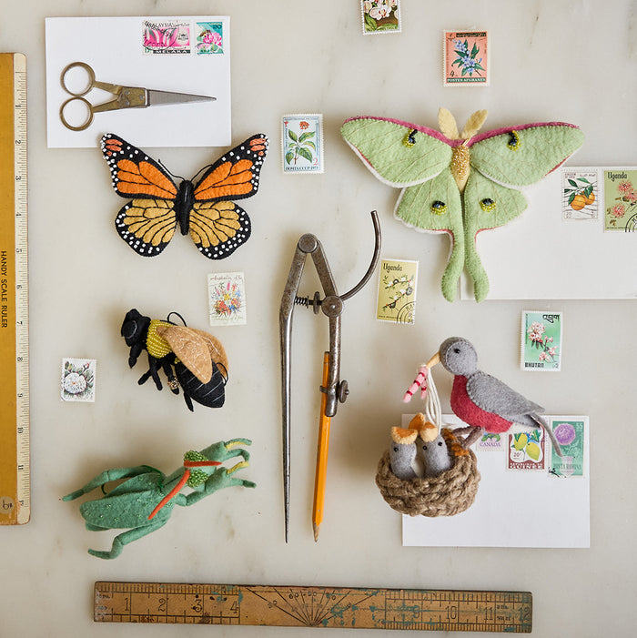Eco-conscious Luna Moth ornament made from natural wool, symbolizing transformation and supporting youth environmental education through the Pollinator Collection