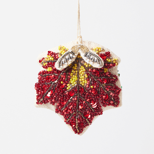 Autumn maple leaf ornament with detailed bead veins and dangling samaras, perfect for Thanksgiving or nature-inspired décor.