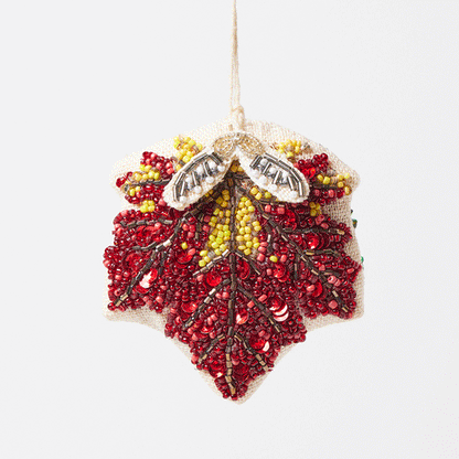 Autumn maple leaf ornament with detailed bead veins and dangling samaras, perfect for Thanksgiving or nature-inspired décor.
