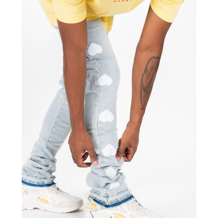 Model wearing PHEELINGS Heartbeat of Success Light Sand Blue Flare Stack Denim jeans, showcasing the flattering fit and stylish design