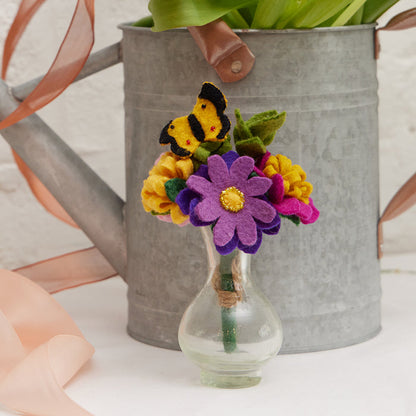 Hand-felted wildflower bouquet with butterfly in recycled glass vase, artisan-made summer decor.