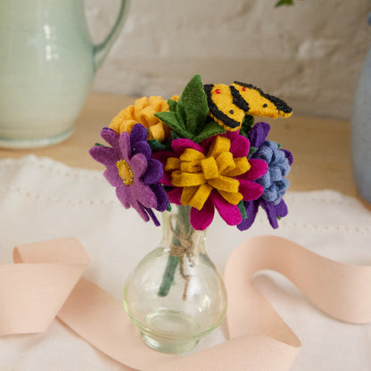 Whimsical summer bouquet with butterfly and wildflowers, handcrafted from wool felt.