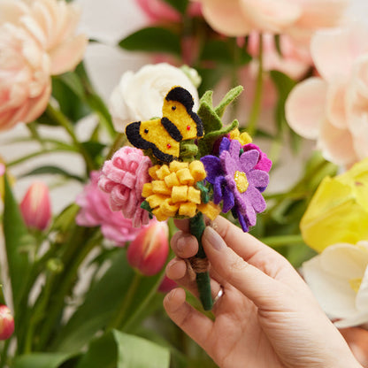 Hand-felted wildflower bouquet with butterfly in recycled glass vase, artisan-made summer decor.