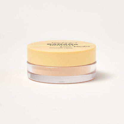 A banana bright loose powder on a white background.