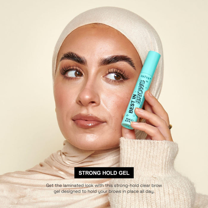 A model holding the best in brows brow gel next to her face. The product is used on her eyebrows.