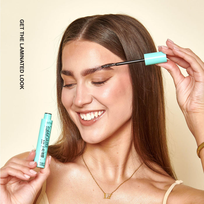 A model applying the brow gel with text next to her saying "Get the laminated look"