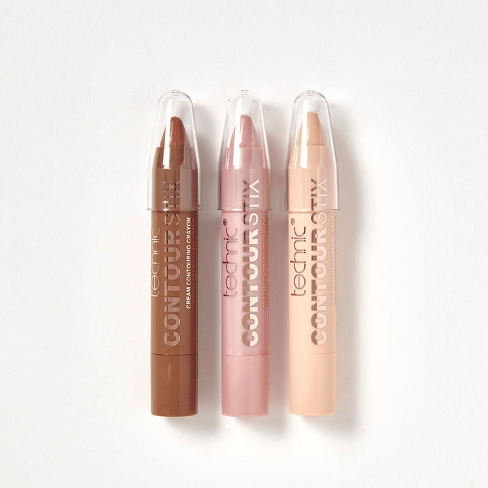 The 3 contour sticks out of the packaging on a white background. There is a contour stick, a blusher stick and a highlighter stick.