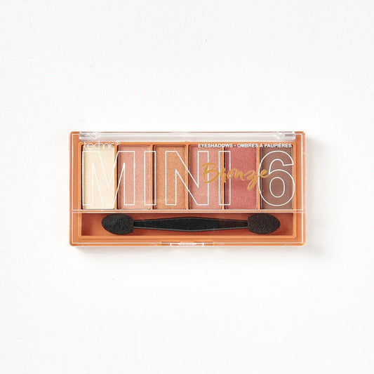 A mini 6 Bronze eyeshadow palette on a white background. It contains bronze and shimmer shades.