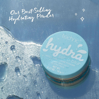 Light blue Technic hydrating powder compact on wet shimmering surface