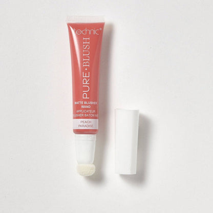 An opened blusher wand in the shade Peach Paradise on a white background.